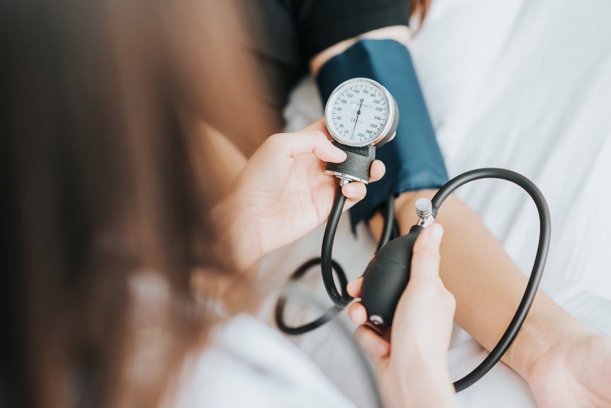 Medical Professional Taking Blood Pressure